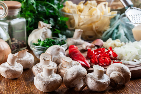 Ingredients ready for prepare tagliatelle pasta with champignon