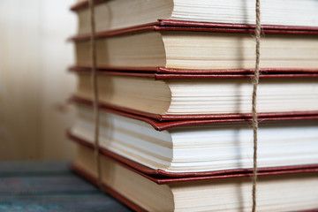 Education and reading concept - group of colorful books on the wooden table
