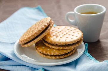 cup of coffee with biscuits