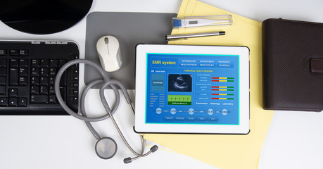 Medical record system show patient information on digital tablet.
