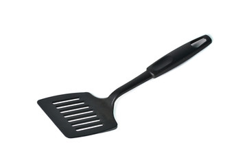 Black plastic kitchen spatula isolated on white background