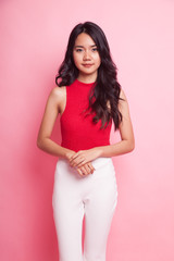 Portrait of beautiful young Asian woman in red shirt.