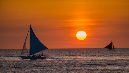 Sailing boats on the sea at the sunset at Boracay island,Philippines