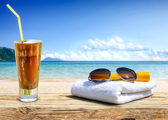 summer drink on desk and beach landscape 