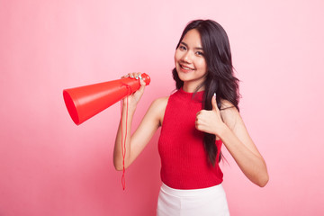 Beautiful young Asian woman show thumbs up announce with megaphone.