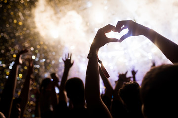 Portrait of happy crowd enjoying at music festival