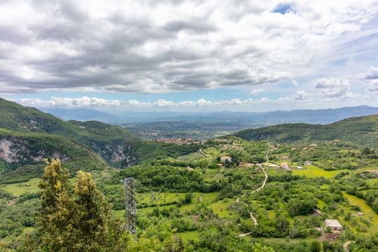 Campania, Italy.  View From the Matese Mountains Towards the Town of Castello Del Matese and the Volturno Valley Beyond.