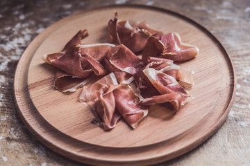 Italian jamon on  wooden  board