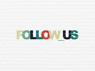 Social media concept: Painted multicolor text Follow us on White Brick wall background