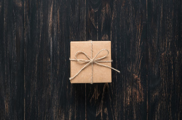 gift box tied with string on a dark background