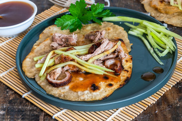 Crispy duck with pancakes, plum sauce, shredded cucumber and spring onion