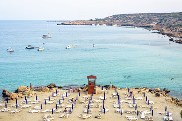 Daylight view from top to Konnos beach with people