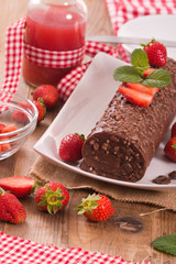 Chocolate roll with strawberries. 
