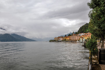 View of Lake Como in cloudy day with the buildings of Bellagio, a charming tourist village between the lake and the mountains of the Alps. Located in the Lombardy region, northern Italy