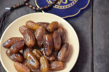 A glass of drinking water and date fruits - a food that is consumed before breaking fast during holy month of Ramadan.