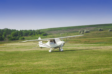 small airplane ready to take off on the airfield