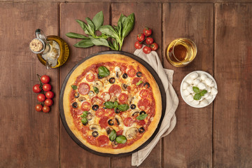 Pepperoni pizza with white wine, ingredients, and place for text