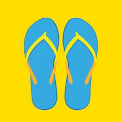 ein paar blau gelbe flipflops auf gelben hintergrund