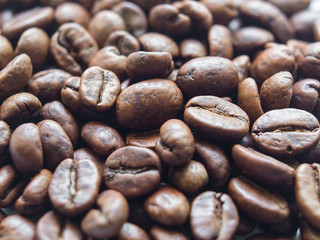 Roasted coffee beans macro. Shallow DOF, selective focus.