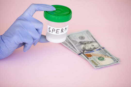 Health. Sperm Analysis. Concept of Bank Sperm. Infertility. Doctor's Hand Holding Container for Analyzes.