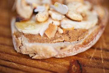 Delicious peanut butter, banana and cashew nut open faced sandwich