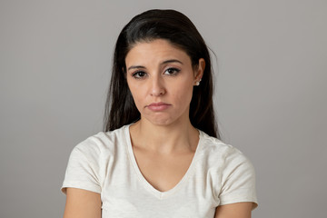 Fototapeta premium Human expressions, emotions. Young attractive woman with a sad face, looking depressed and unhappy