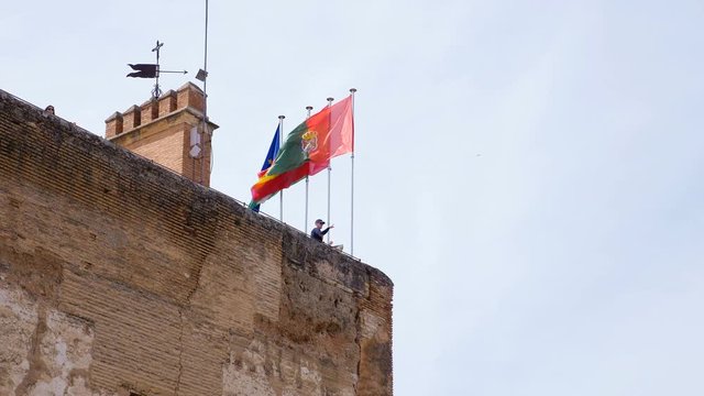 Flags waving on the Alhambra Palace- Granada, Spain