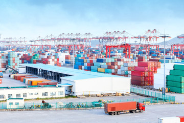 busy harbour with full loads of containers in the port - obrazy, fototapety, plakaty