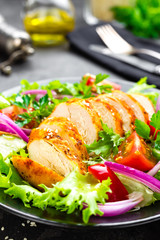 Salad with chicken meat. Fresh vegetable salad with chicken breast. Meat salad with chicken fillet and fresh vegetables on plate