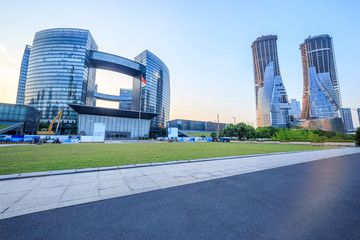 empty, modern square and skyscrapers under sunbeam