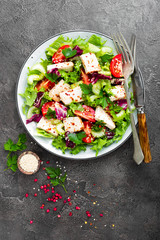 Meat salad with fresh vegetables. Vegetable salad with baked chicken breast. Vegetable salad with chicken fillet on plate