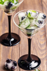 Ice cubes with dill, estragon and blueberry 