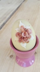 Fototapeta na wymiar Beautiful handmade Easter egg on wooden background