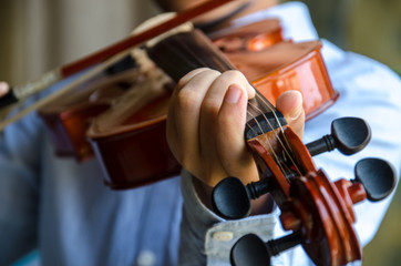 A young artist playing violin and
