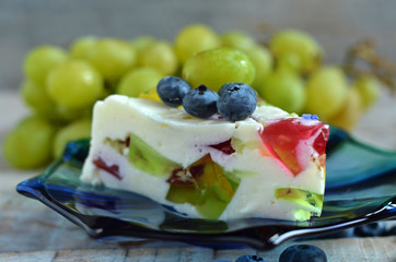 A piece of yogurt on a blue plate