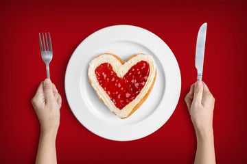 Heart shaped donut on white plate for valentine's day