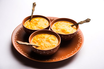Mango Pulp / Aam rus or Ras served in small bowls, selective focus