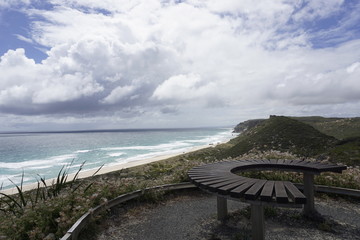 Bench on a cloudy beach