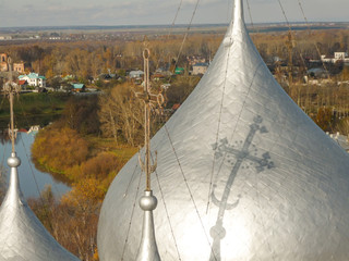 a view from above on the domes of a Russian church of silver color on a sunny day