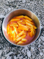 Cooking pasta outdoors on a hike