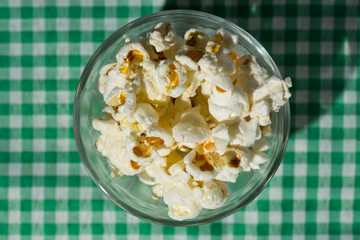 Popcorn. Food of Festa Junina, a typical brazilian party. Snack on green plaid table.