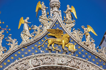 Close-up of marble sculptures and dome in typical Venetian style on the San Marco Basilica. At the city of Venice, the historic and amazing marine city. Located in Veneto region, northern Italy
