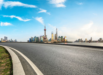 Fototapeta na wymiar Shanghai,China modern city skyline and empty asphalt road