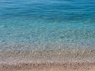 calm beach with clear blue water