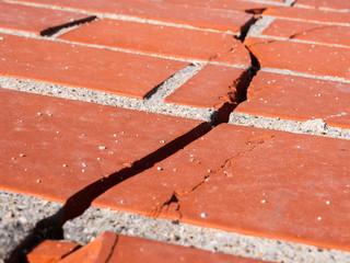 crack in red brick wall break life difficulties