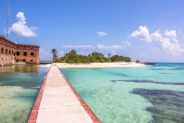 The tropical waters of the Gulf of Mexico surround Historic Fort Jefferson in the Dry Tortugas National Park known for its famous bird, marine life and great place for swimming and snorkeling.