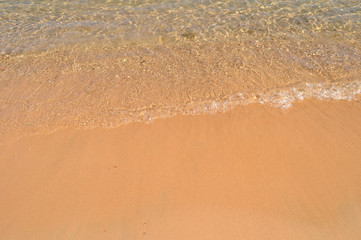 azure coast with white sand, clean and clear blue water on a sunny day