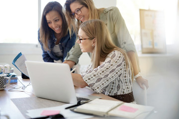 Startup businesswomen meeting in office and working on laptop