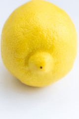 Bright Yellow Organic Lemon on White Background. Peel Texture. Template for Cooking Healthy Lifestyle Blog. Minimalist Style. Copy Space