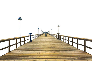 Fototapeta premium Perspective view of a fishing pier wooden isolated on white background. Concept of simplicity, purpose, direction and infinity.